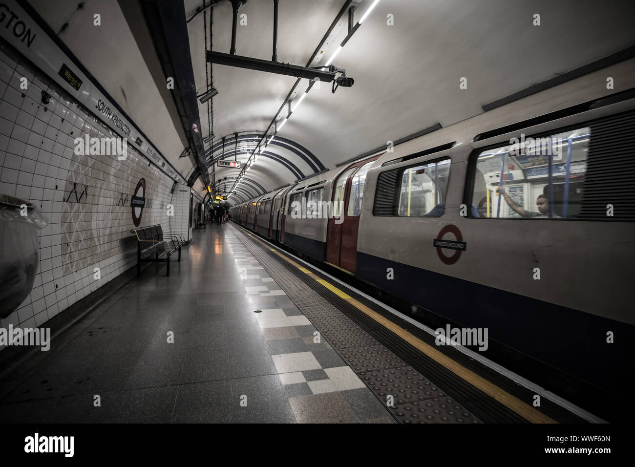 Underground train at platform in South Kensington Station, London Stock
