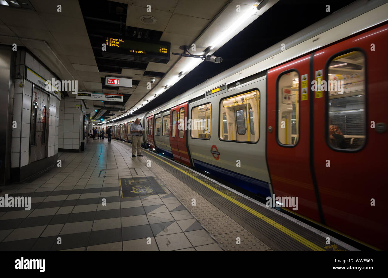 An underground train at the platform in Monument Station, London Stock