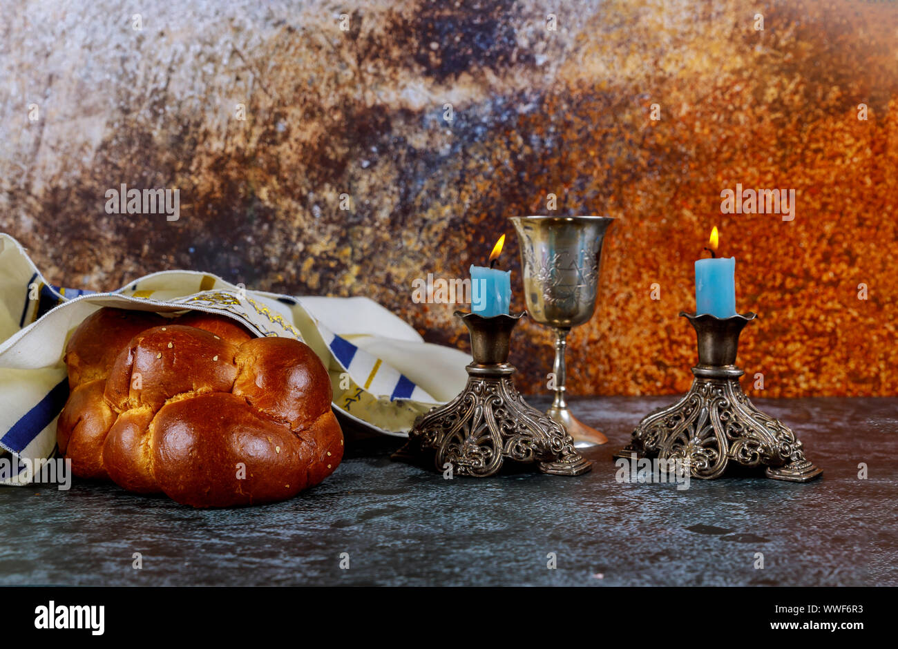 Jewish Holiday shabbat eve with challah bread, Sabbath candles and