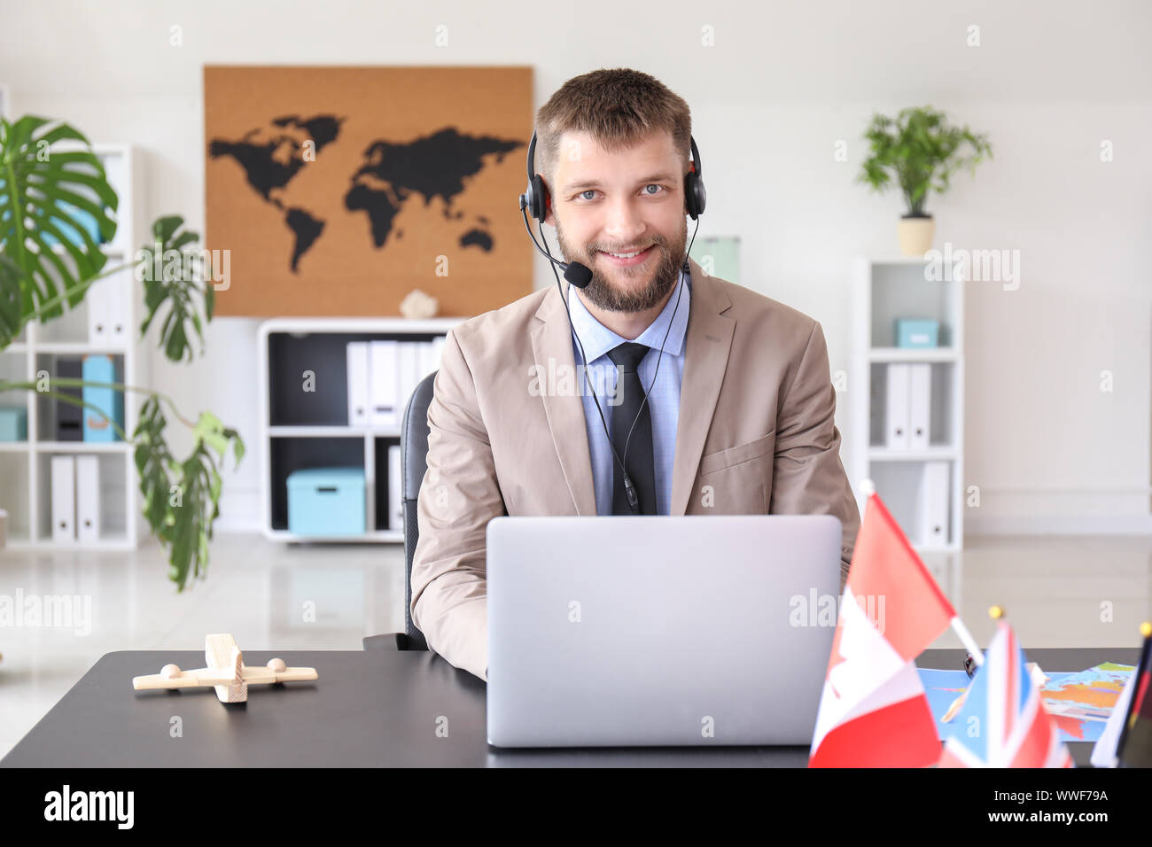 Male travel agent in office Stock Photo