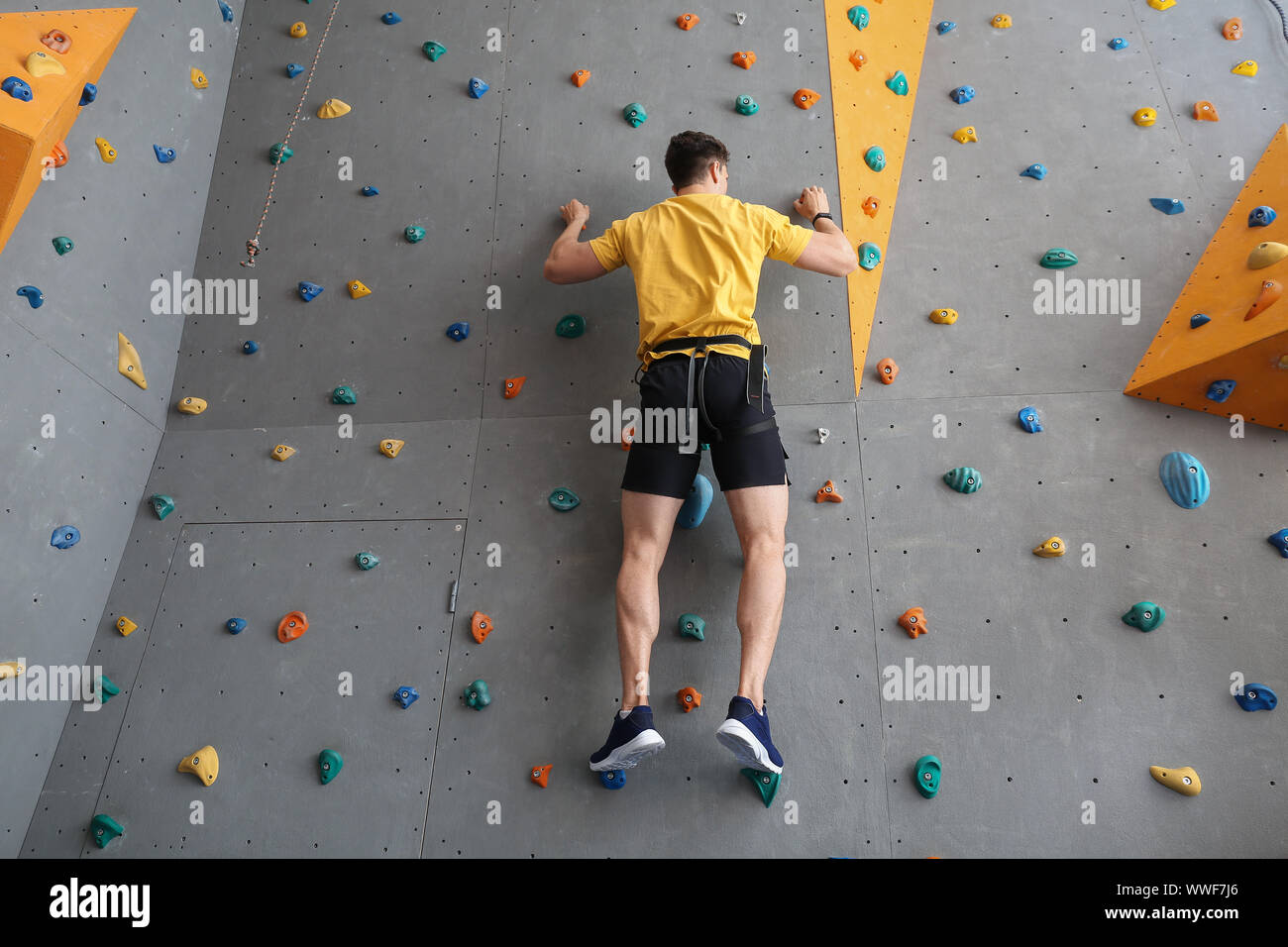 Man climbing wall hi-res stock photography and images - Alamy