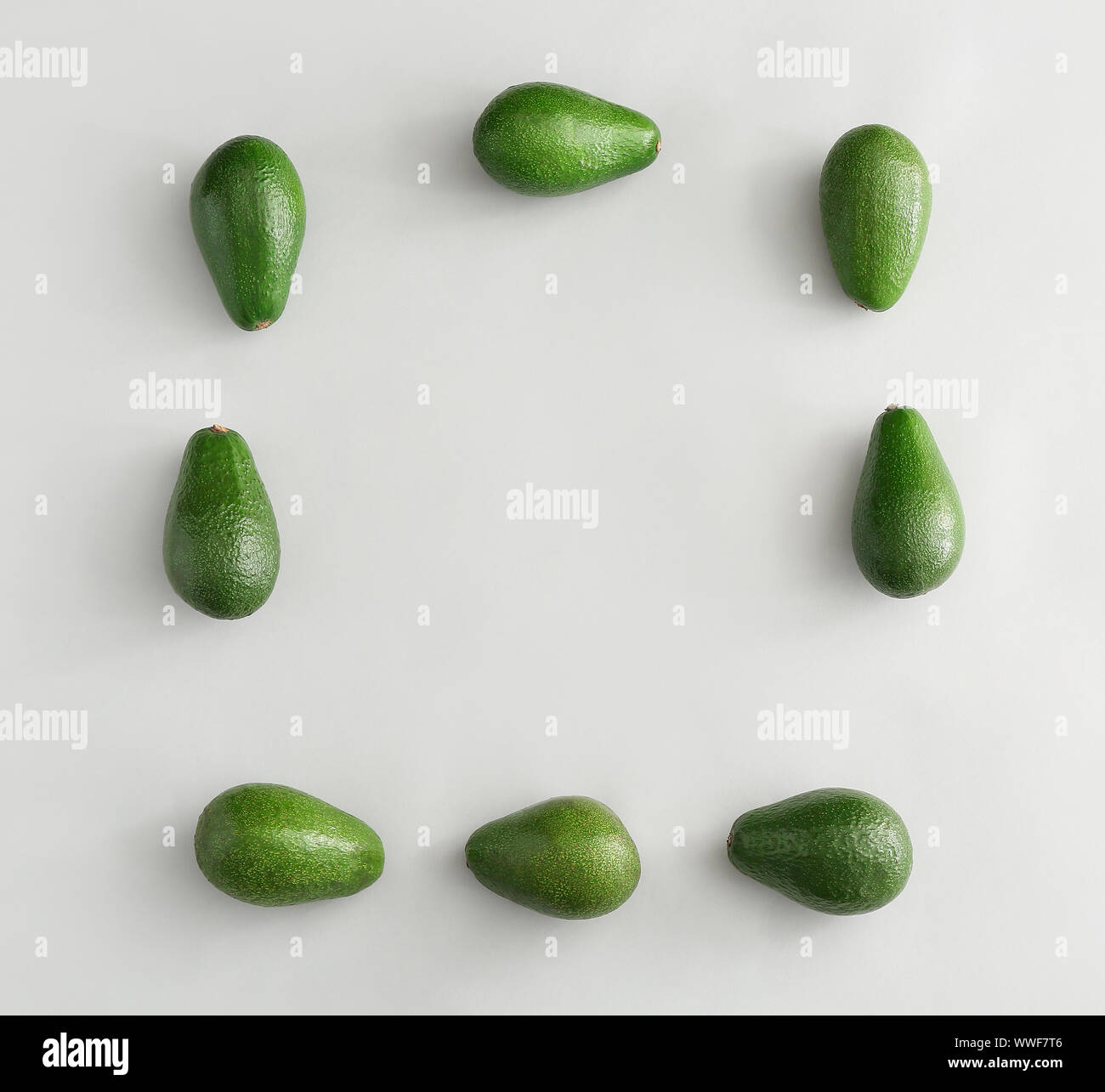 Frame made of ripe avocados on white background Stock Photo
