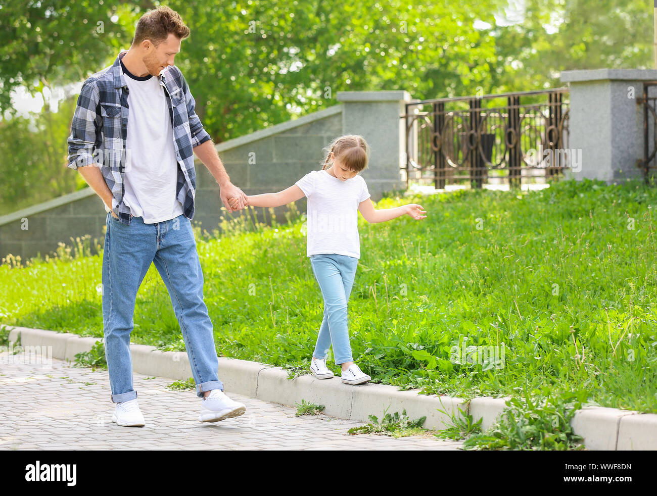 Happy father and his little daughter walking outdoors Stock Photo - Alamy