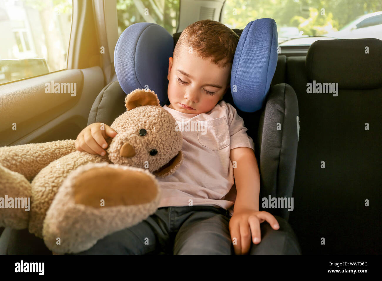Baby boy sleeping on car safety seat Stock Photo Alamy