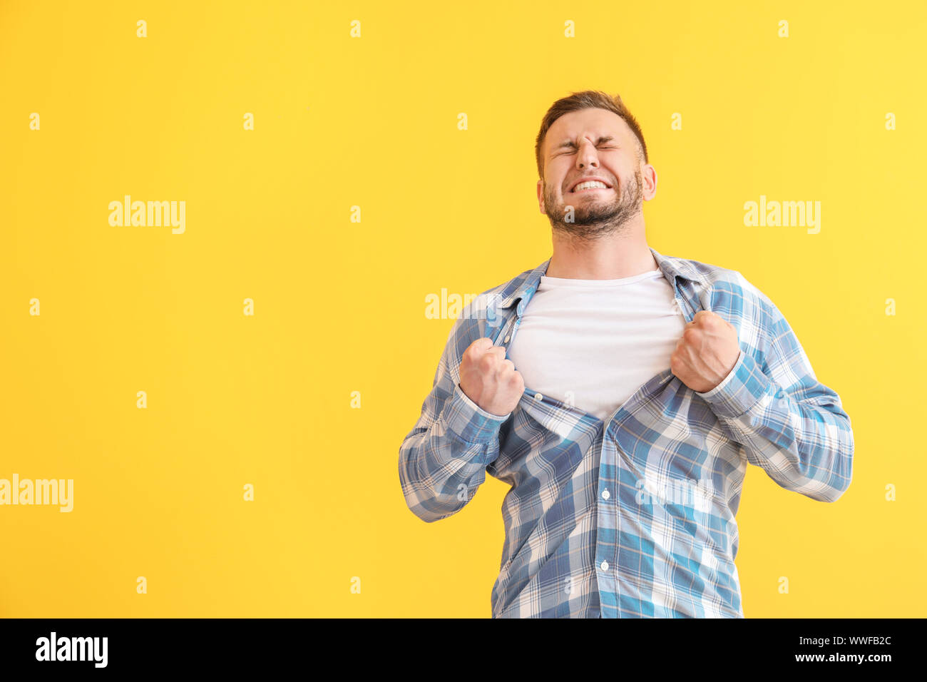 Man having panic attack on color background Stock Photo
