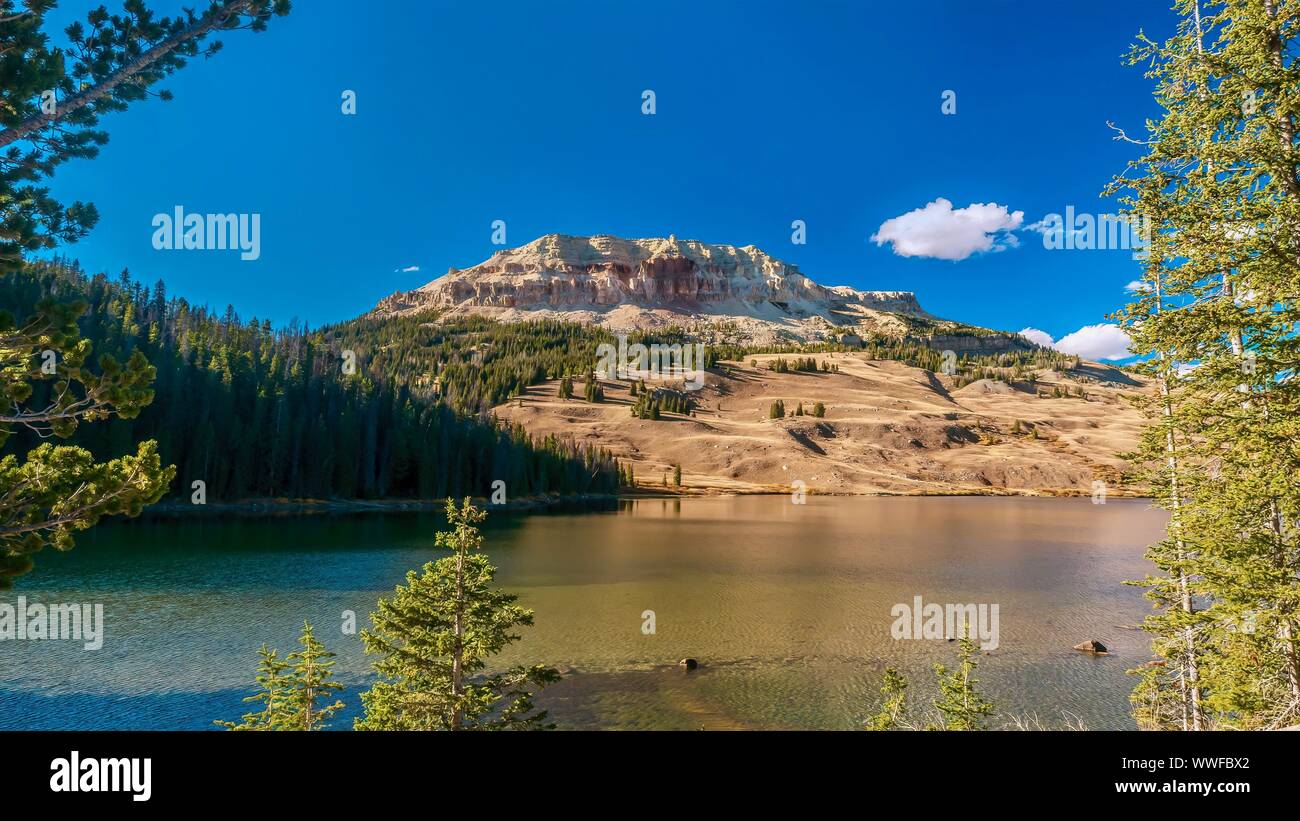 A beautiful American landscape scene, with Beartooth Lake and the ancient geological formation of Beartooth Butte in the background, located in Wyomin Stock Photo