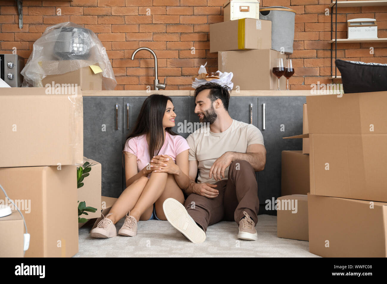 Happy young couple after moving into new house Stock Photo - Alamy