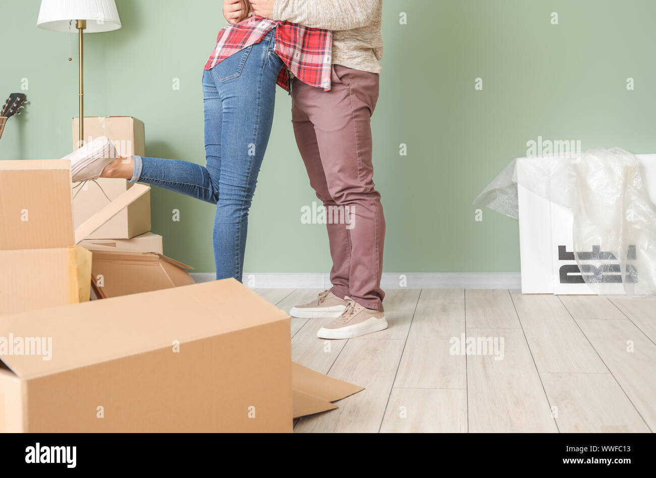Happy young couple with cardboard boxes in their new house Stock Photo ...