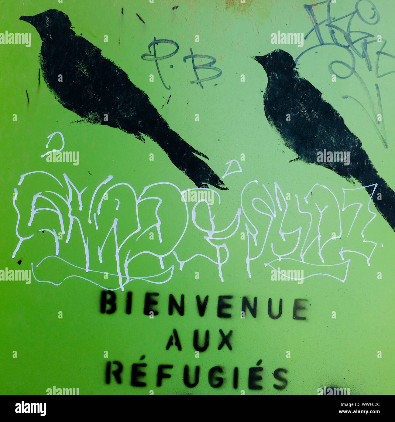 Refugees welcome says this graffiti in Montreal Stock Photo