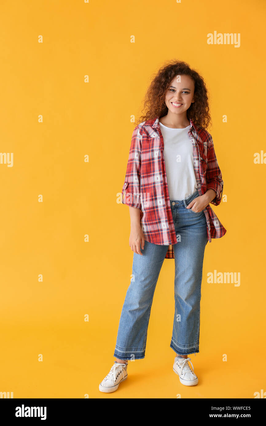 Happy African-American woman on color background Stock Photo - Alamy