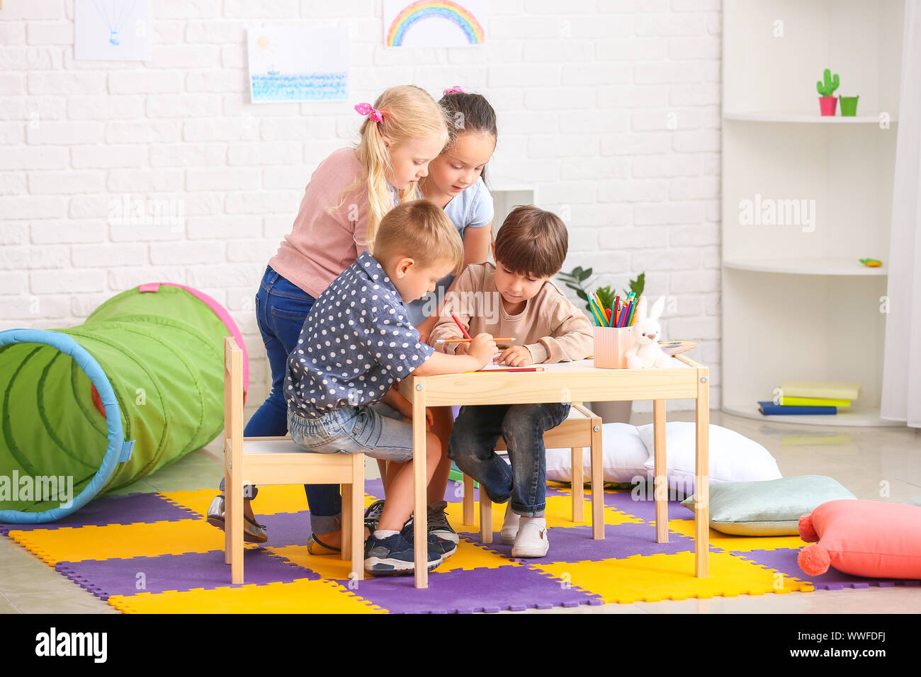 Cute little children in kindergarten Stock Photo - Alamy