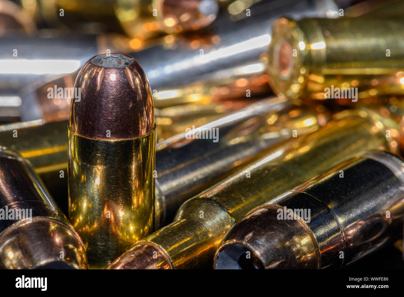 40 caliber semi-automatic handgun ammunition on black background, selective focus Stock Photo