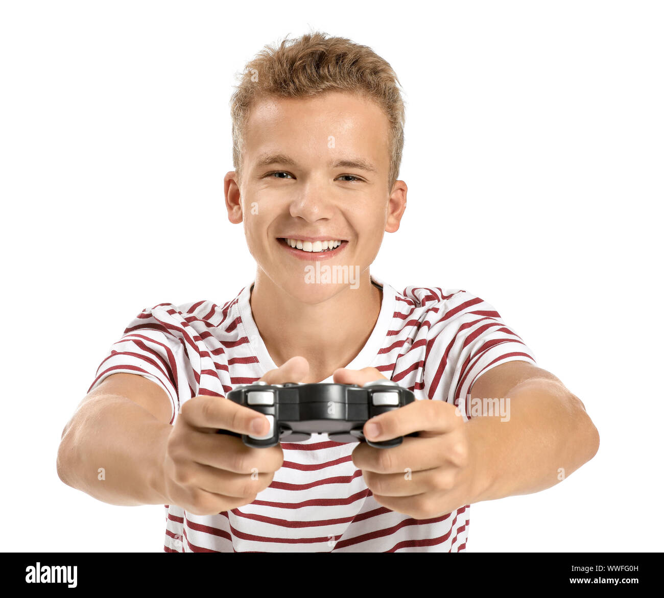 Teenage boy playing video game on white background Stock Photo