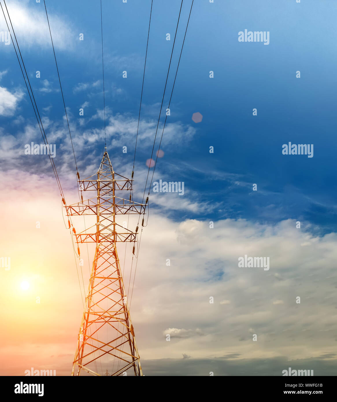 Power transmission line sunset landscape, nice background for presentation about Energy technology or industry. Copy space for your text Stock Photo