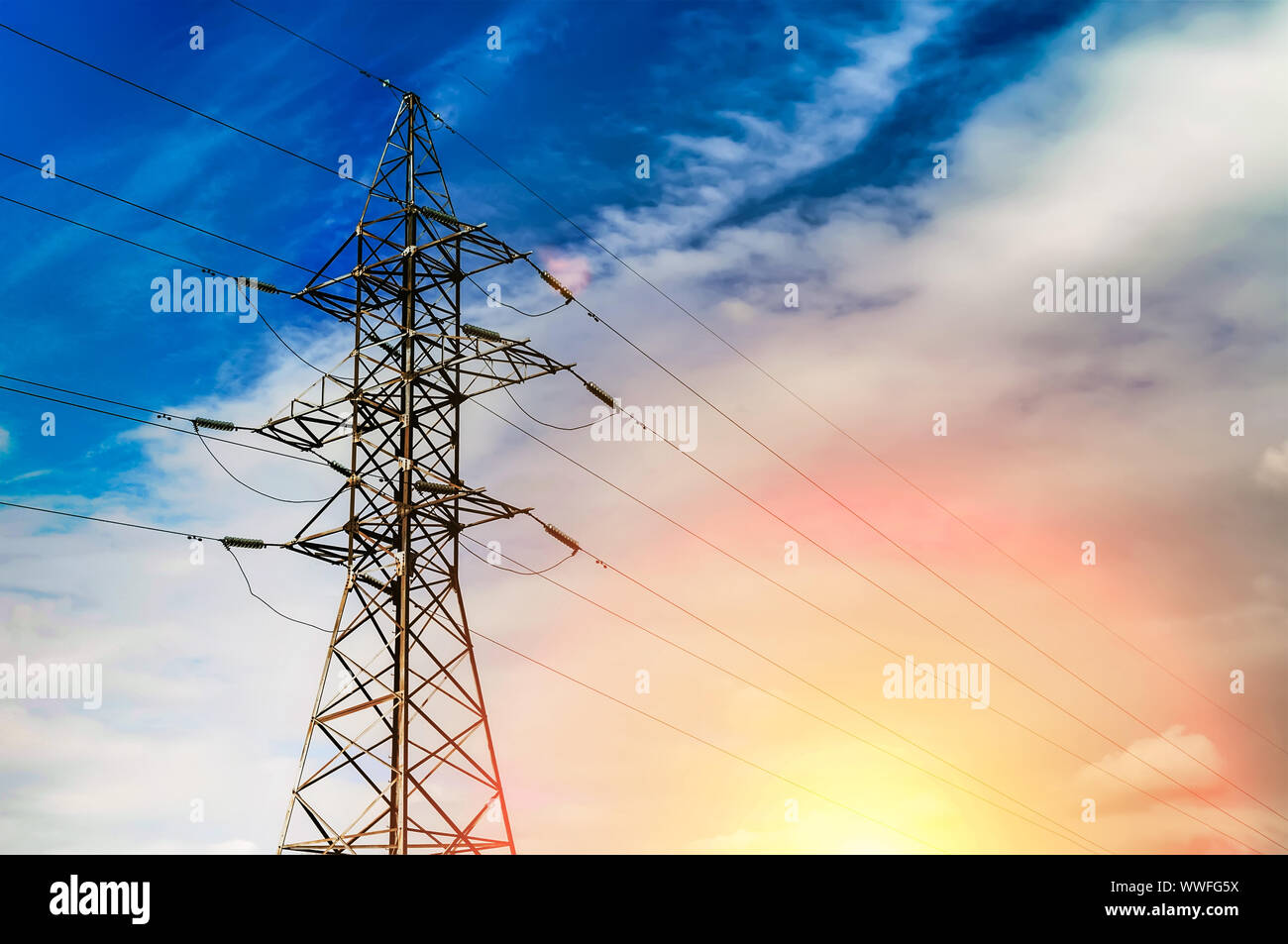 Power transmission line sunset landscape, nice background for presentation about Energy technology or industry. Copy space for your text Stock Photo