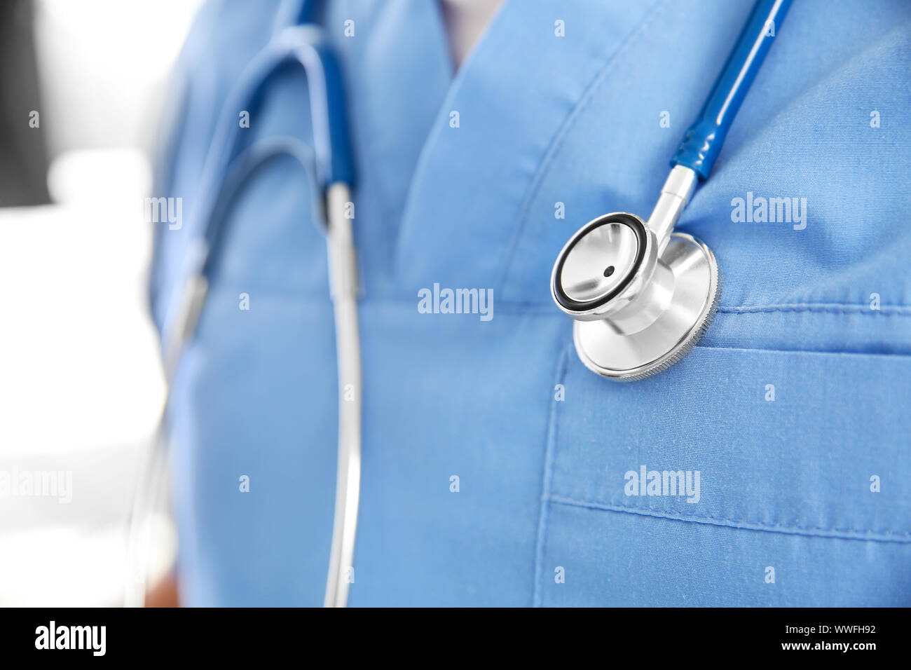 Male nurse with stethoscope in clinic, closeup Stock Photo - Alamy