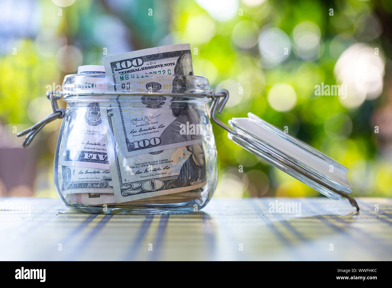 American banknote in glass jar. Stock Photo