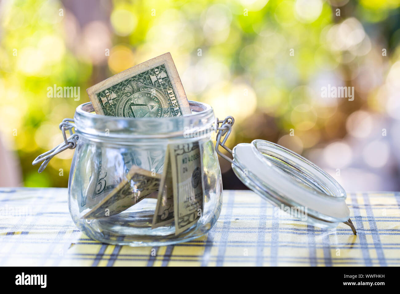 American banknote in glass jar. Stock Photo