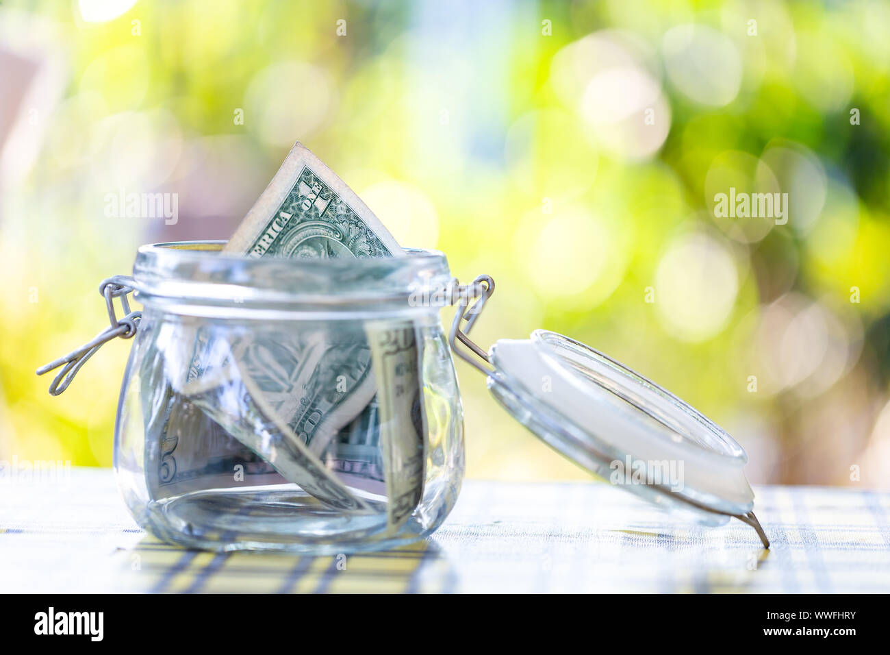 American banknote in glass jar Stock Photo - Alamy