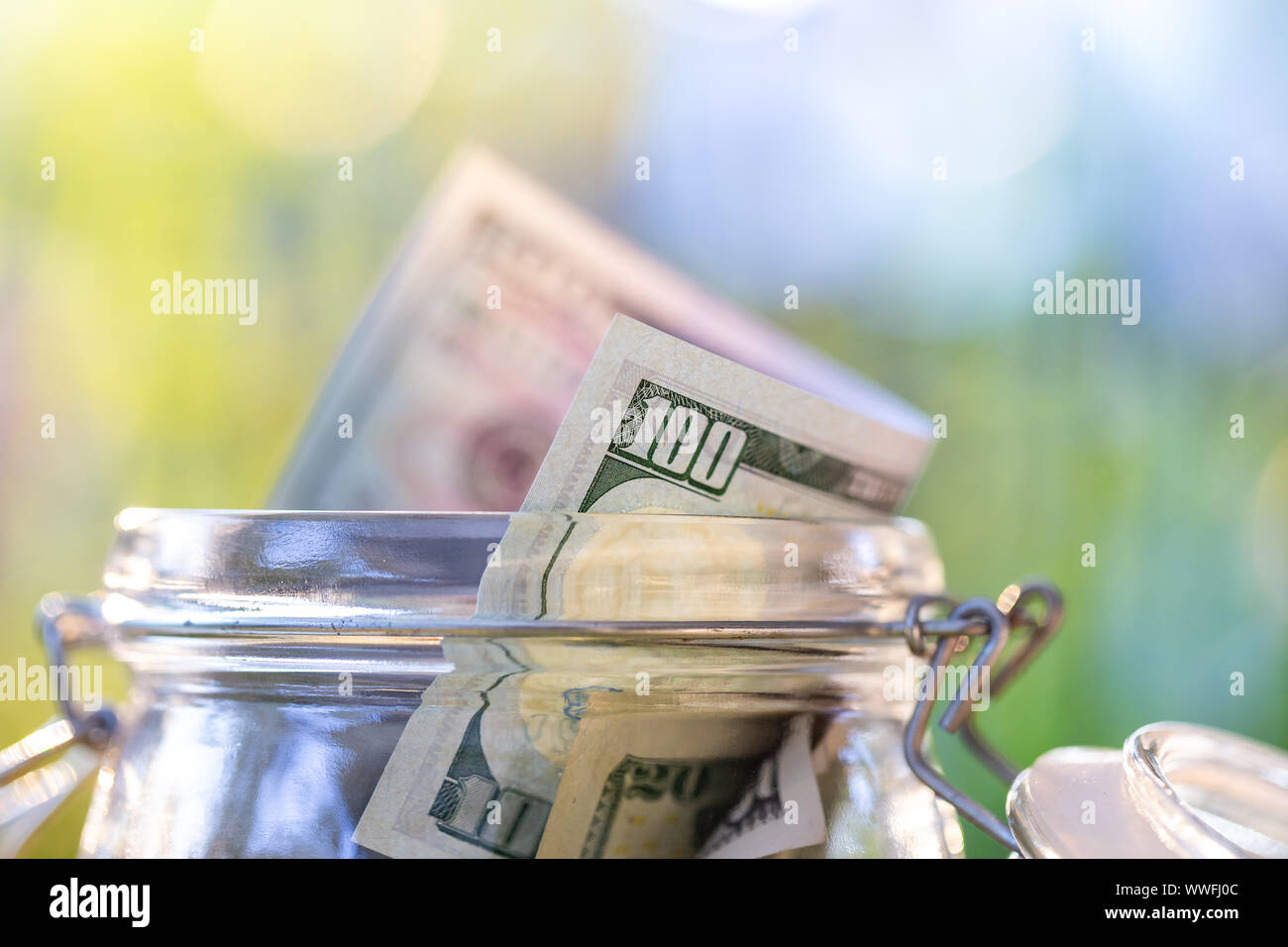 American banknote in glass jar Stock Photo - Alamy