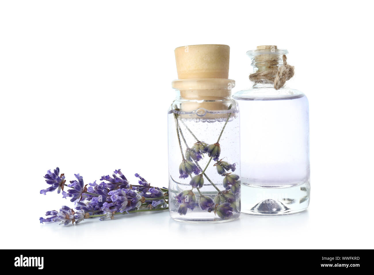 Bottles of lavender essential oil on white background Stock Photo - Alamy