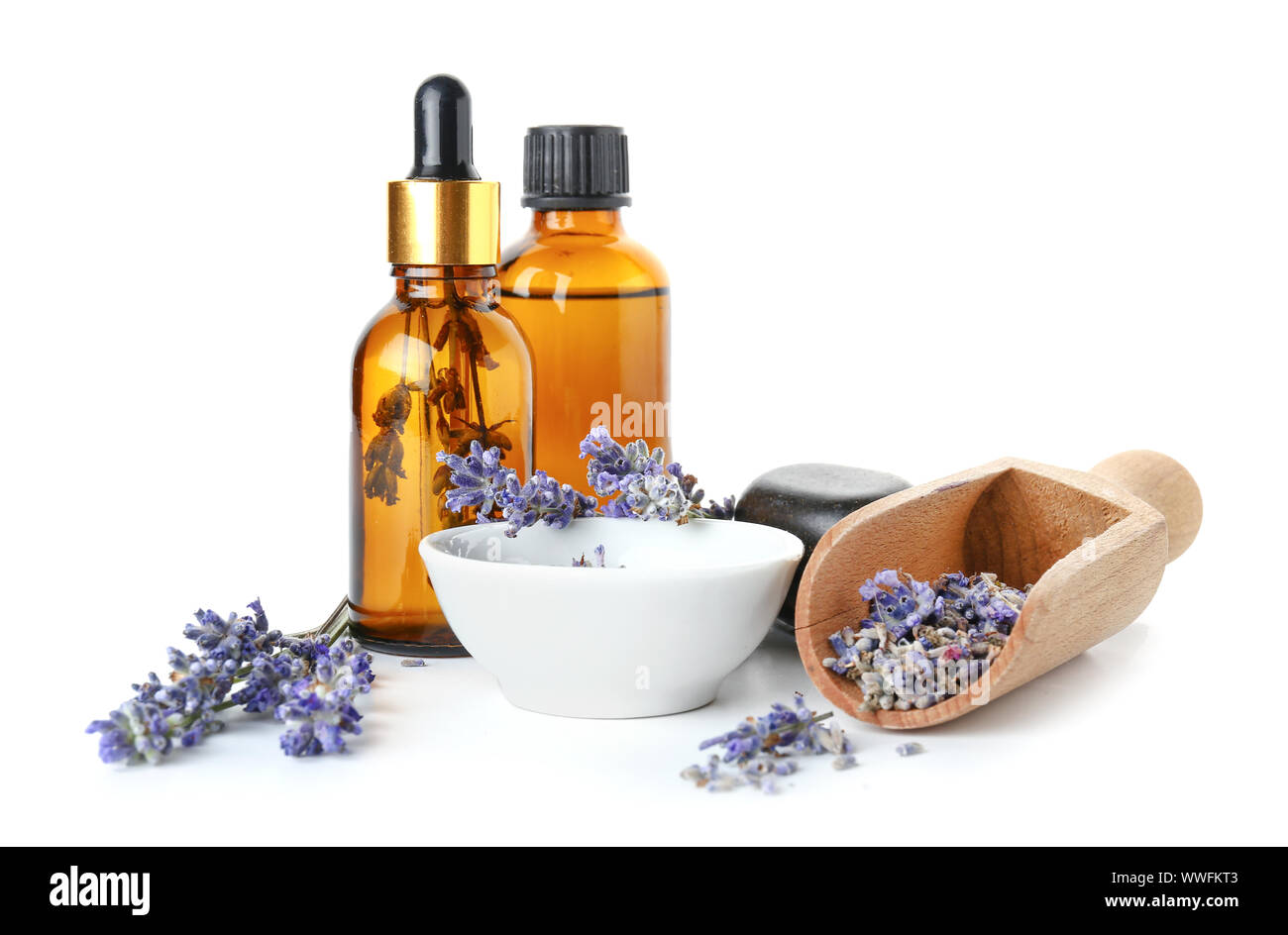 Bottles of lavender essential oil on white background Stock Photo - Alamy