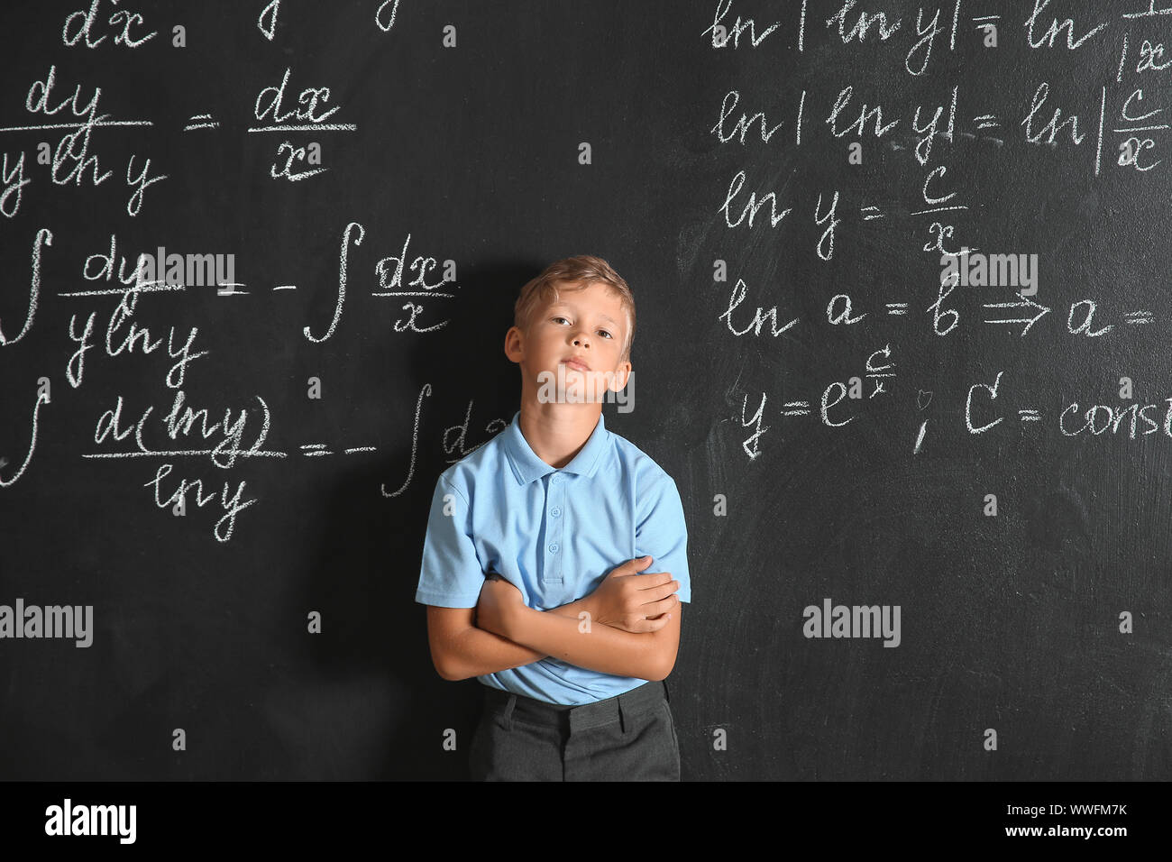 Funny little schoolboy near blackboard Stock Photo - Alamy