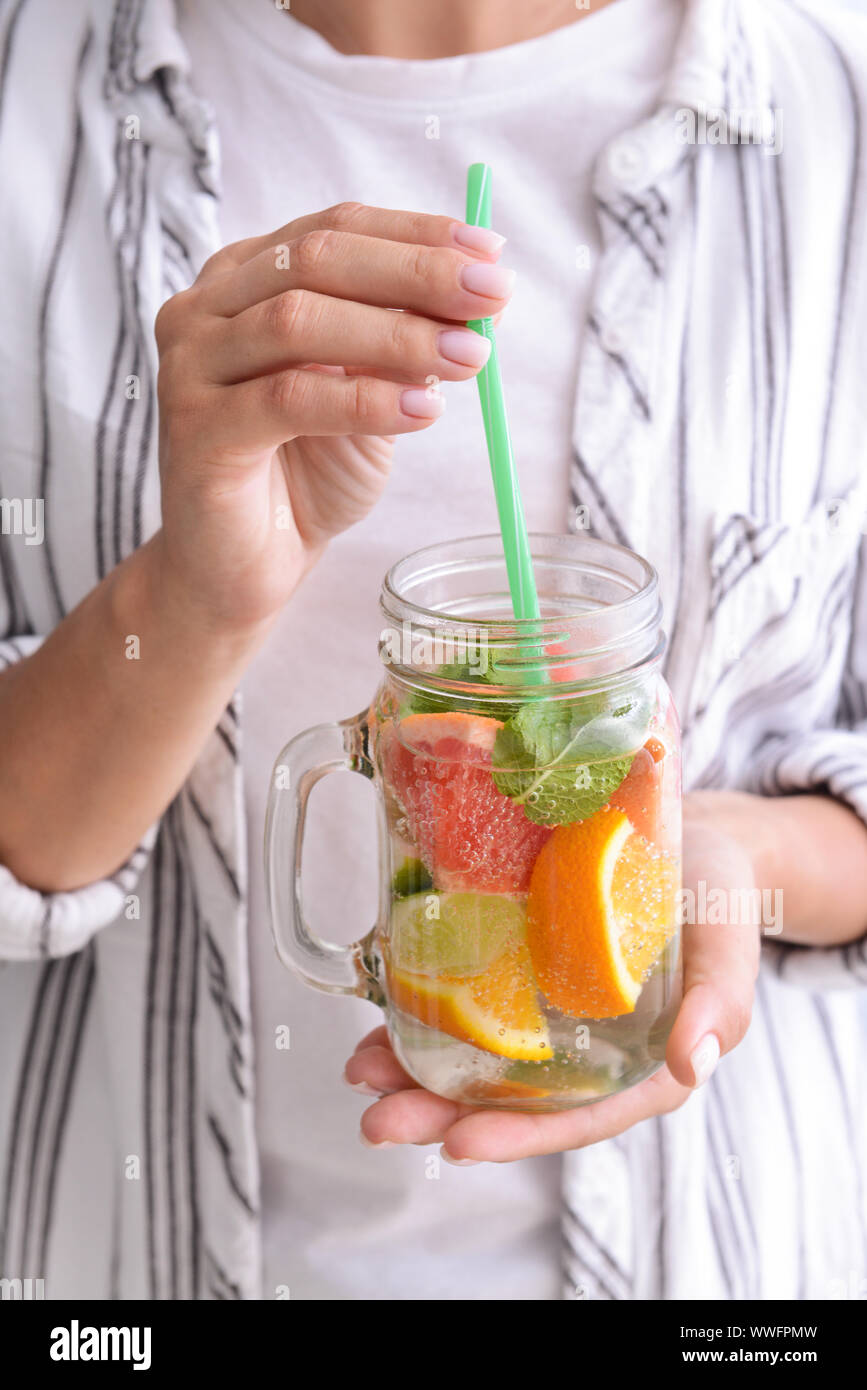 Woman with mason jar of infused water, closeup Stock Photo - Alamy
