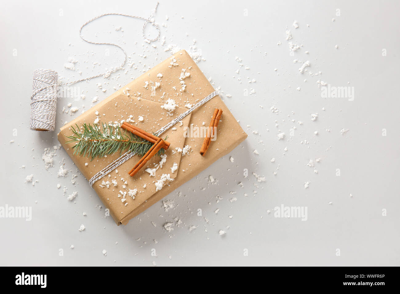Beautiful Christmas gift box with threads on white background Stock ...