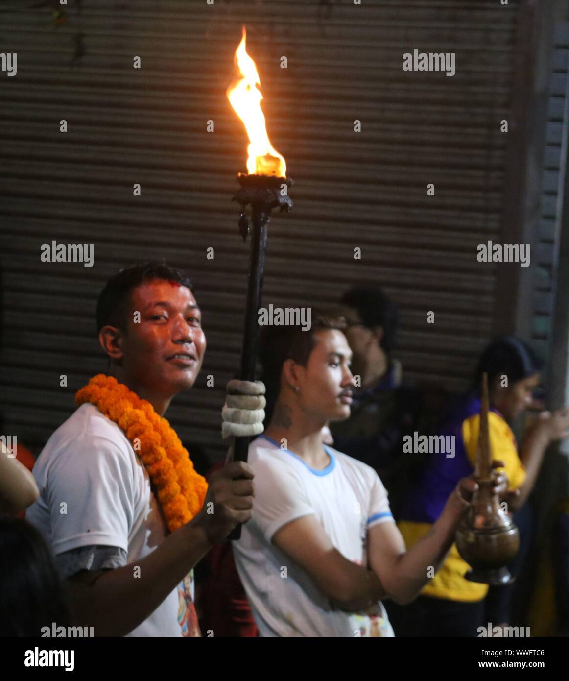 Kathmandu, Nepal. 15th Sep, 2019. People carry the traditional flame offered by people in celebrations of Indrajatra festival in Kathmandu, (Photo by Archana Shrestha/Pacific Press) Credit: Pacific Press Agency/Alamy Live News Stock Photo