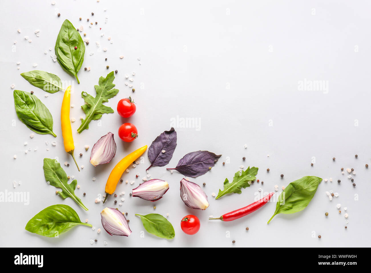 Fresh herbs with vegetables and spices on white background Stock Photo