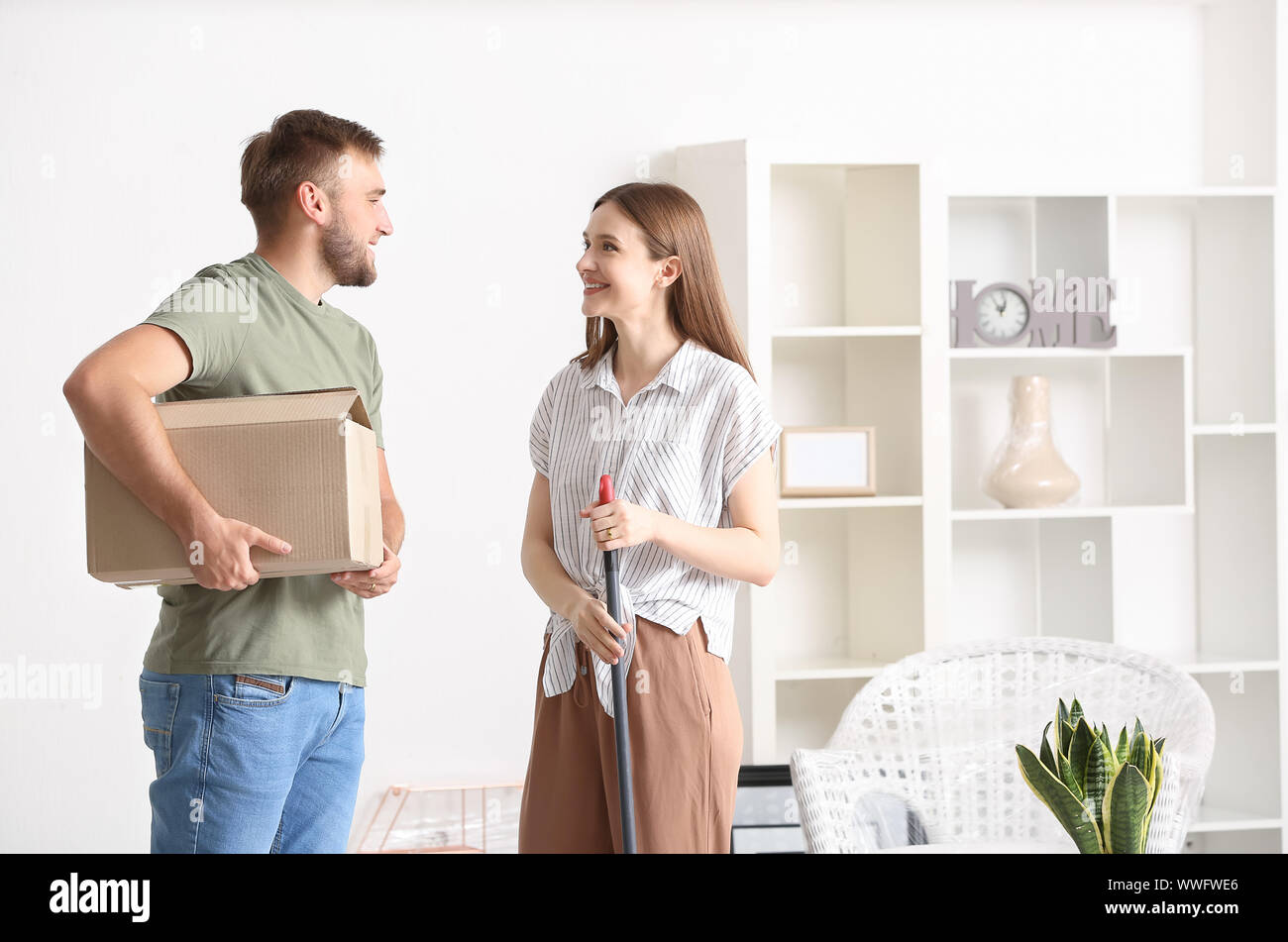 Happy young couple in their new house Stock Photo - Alamy