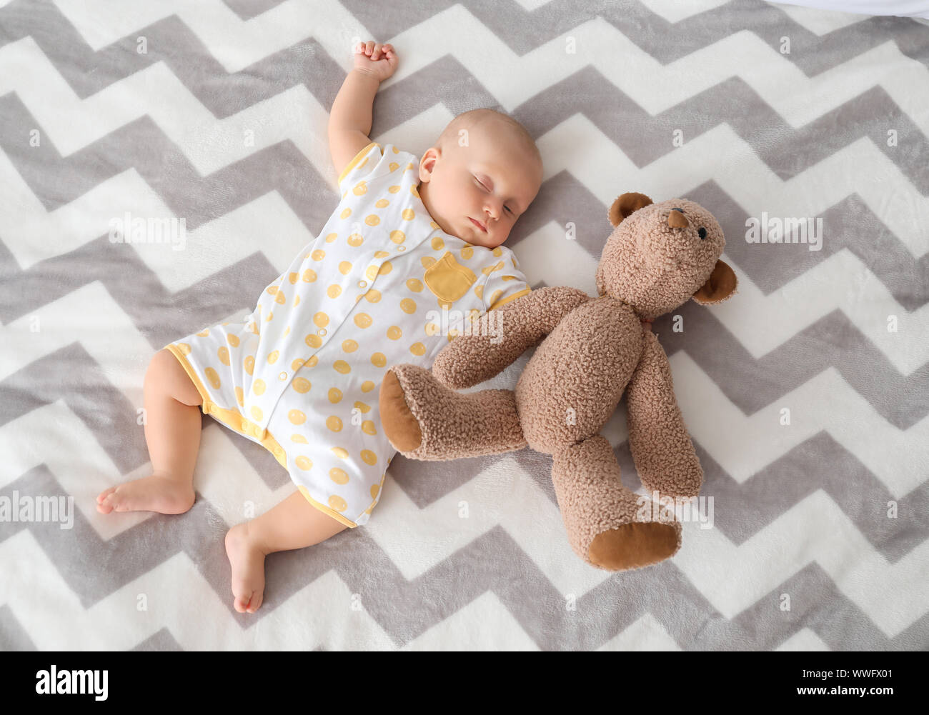 Adorable little baby sleeping on bed Stock Photo Alamy