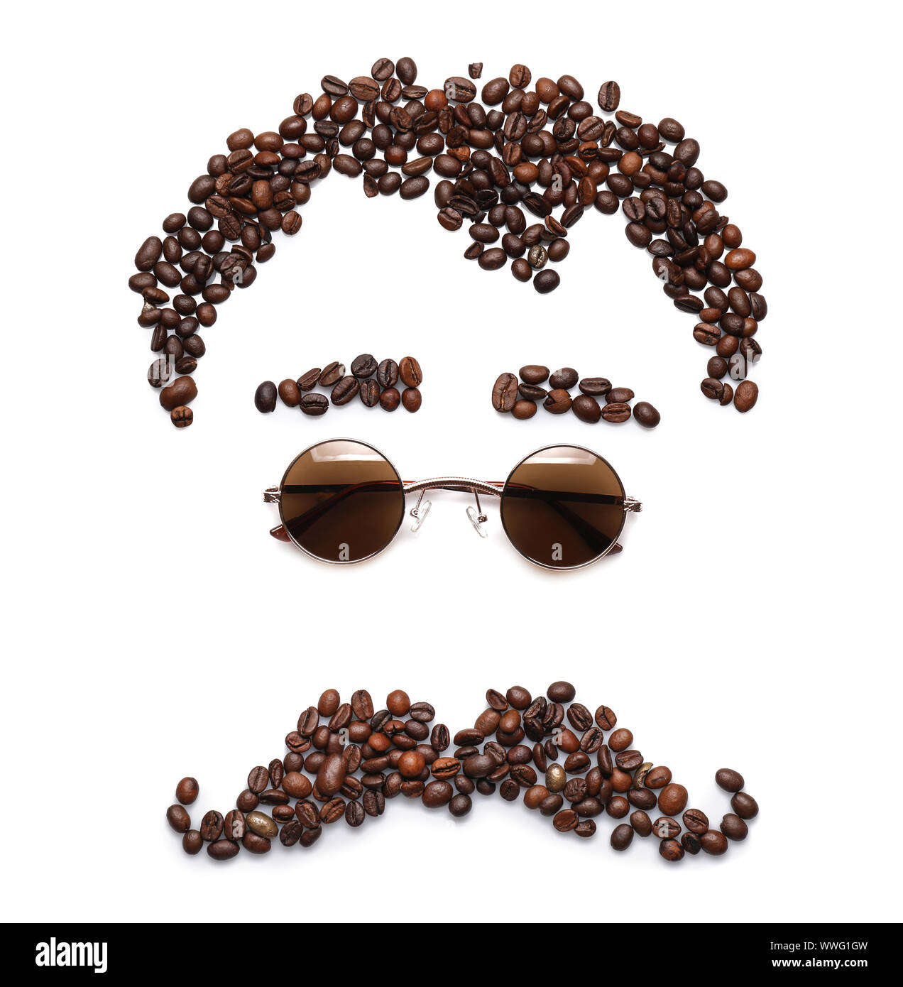 Funny composition with stylish sunglasses and coffee beans on