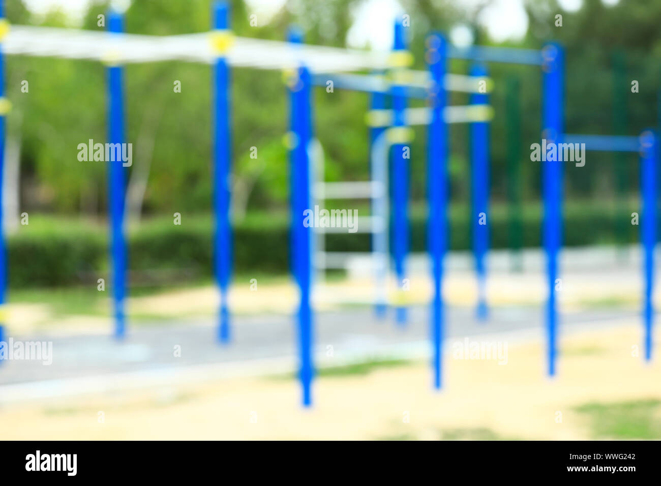Blurred view of monkey bars on playground in park Stock Photo
