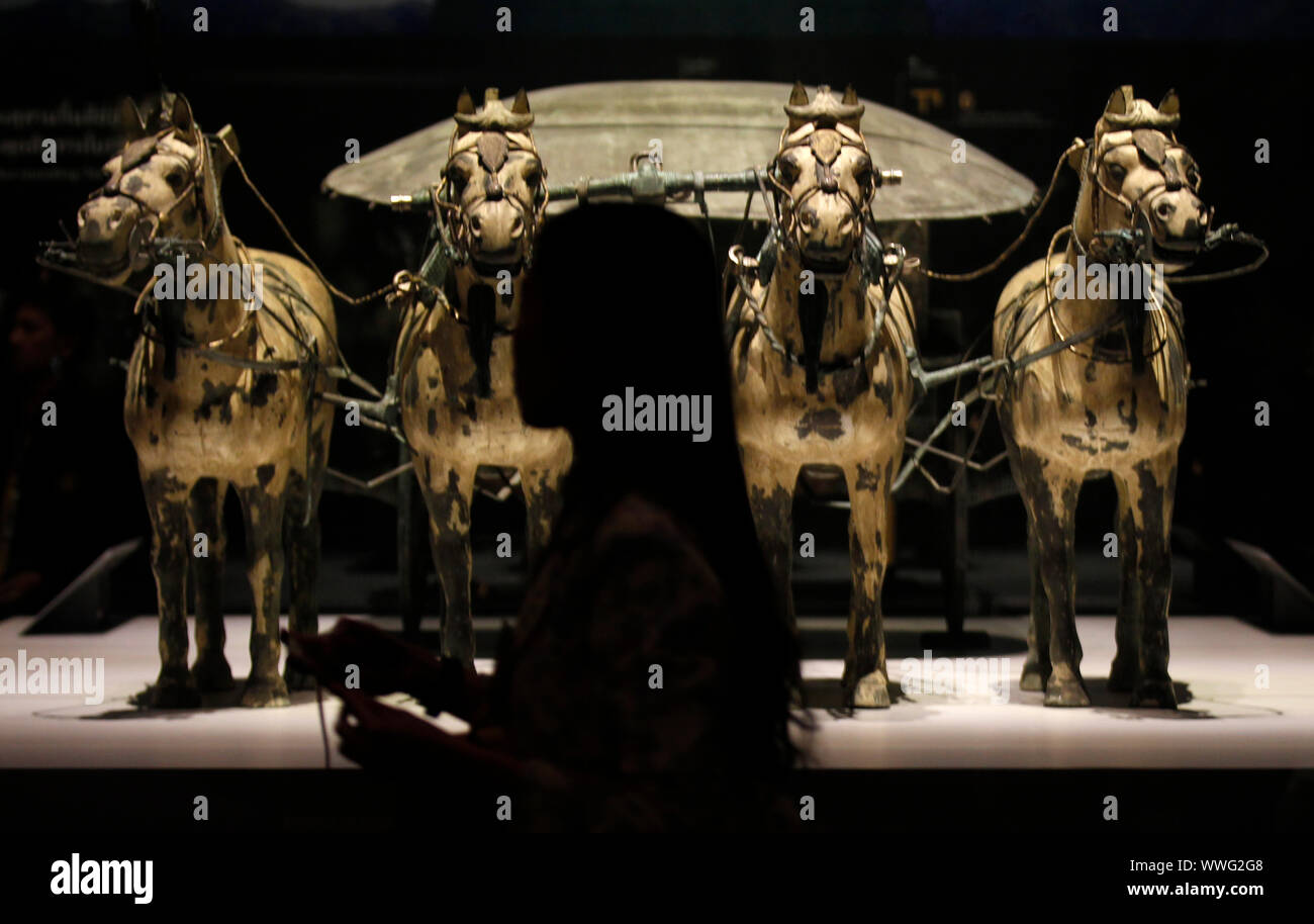 Bangkok, Thailand. 15th Sep, 2019. Visitors seen during the exhibition of Qin Shi Huang, the First Emperor of China and Terracotta Warriors at the National Museum of Thailand in Bangkok.The presentation of the world-class exhibition entitled ' Qin Shi Huang: The First Emperor of China and Terracotta Warriors' marks an unprecedented phenomenon at the Thai museum arena. They team up gather 86 items of important artefacts (133 pieces) aged over 2,200 years from 14 leading museums in China, and all antiquated objects are on display at the National Museum of Thailand. Credit: SOPA Images Limited/Al Stock Photo