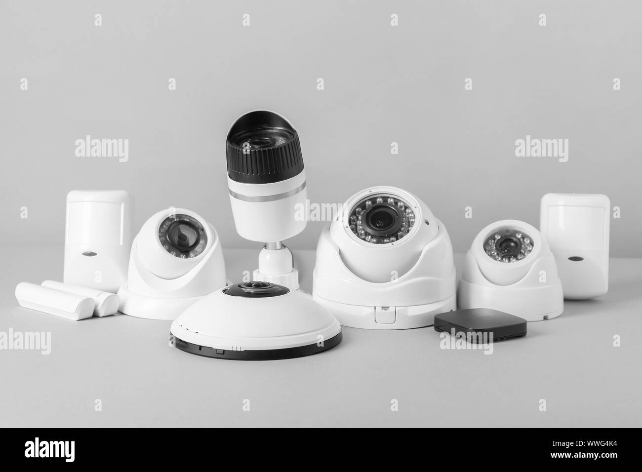 Different equipment of security system on grey background Stock Photo ...