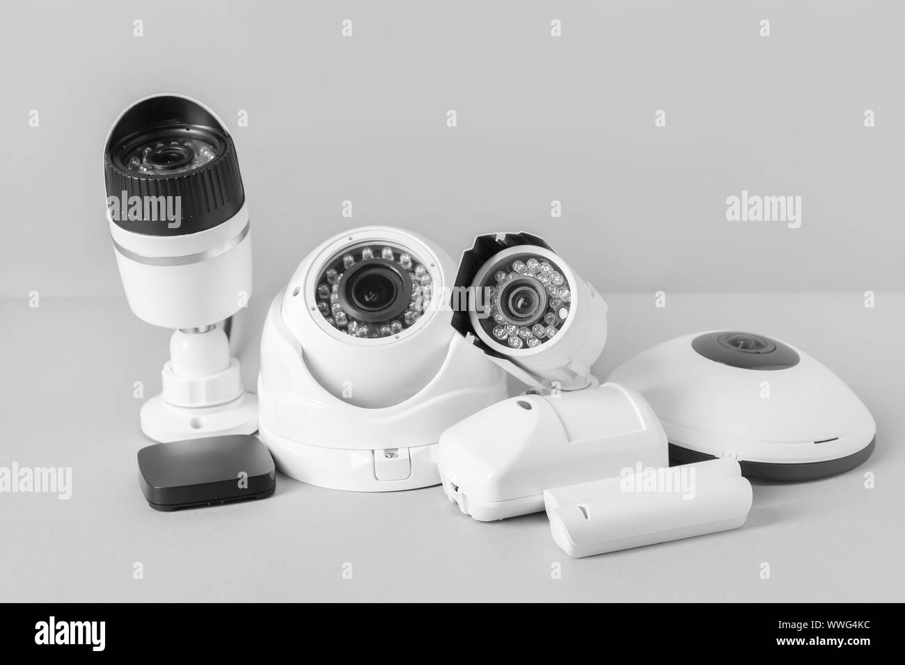 Different equipment of security system on grey background Stock Photo ...