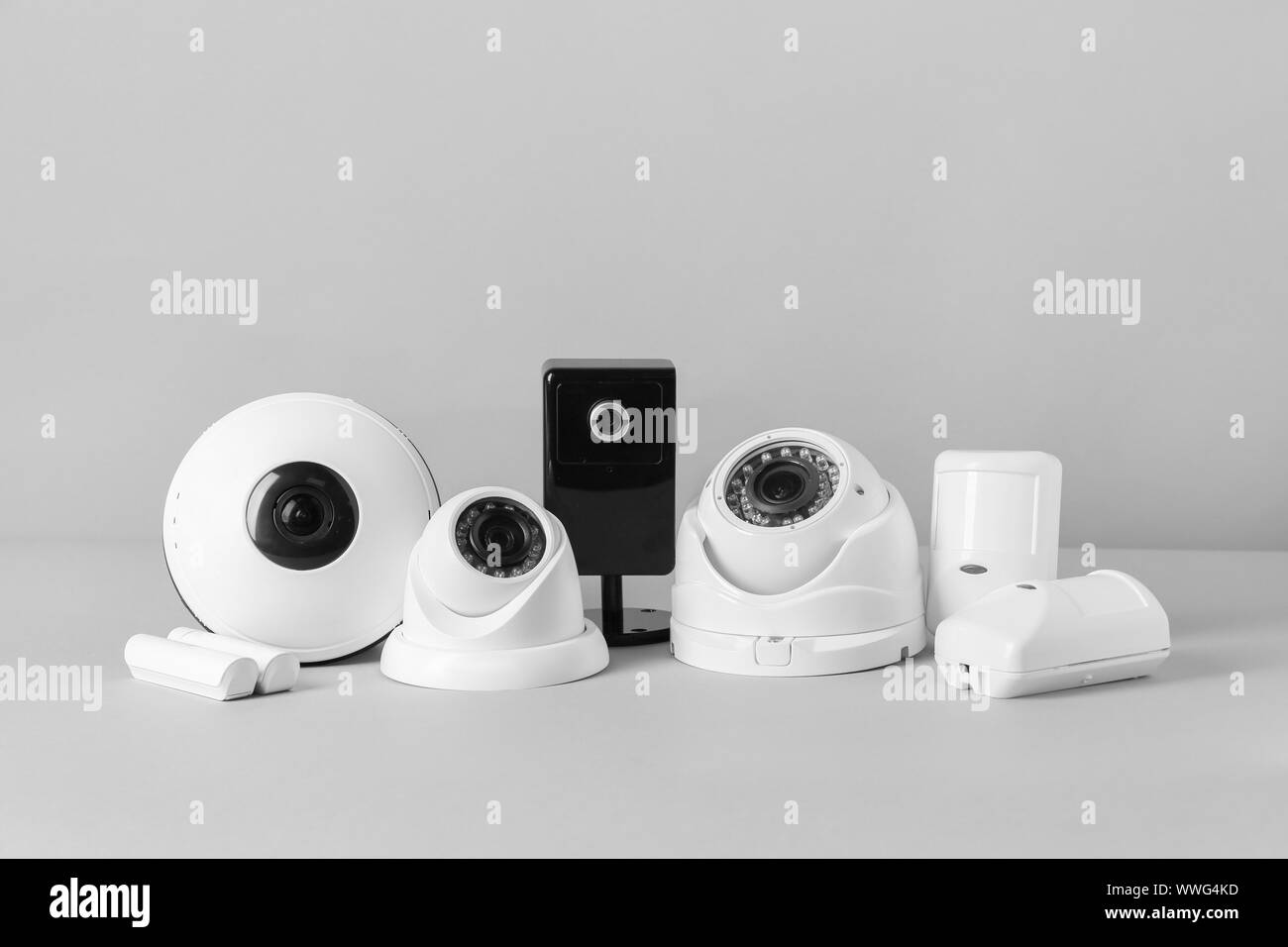 Different equipment of security system on grey background Stock Photo ...