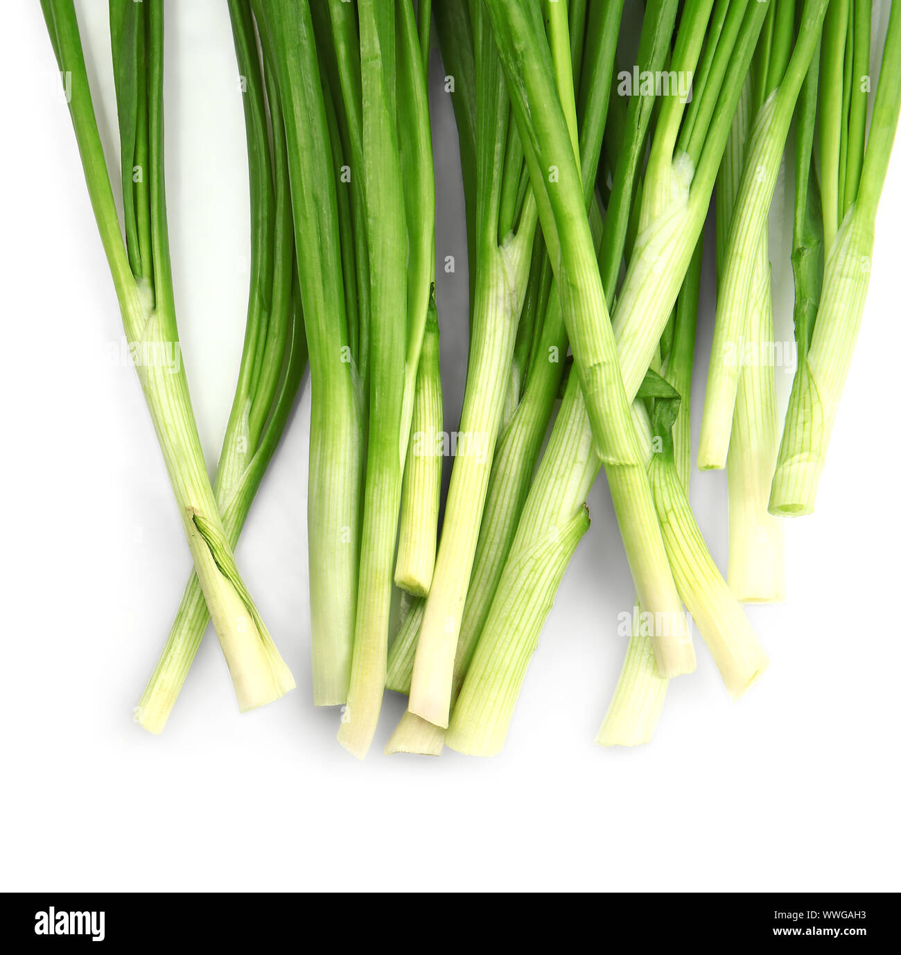 Fresh green onion on white background Stock Photo - Alamy