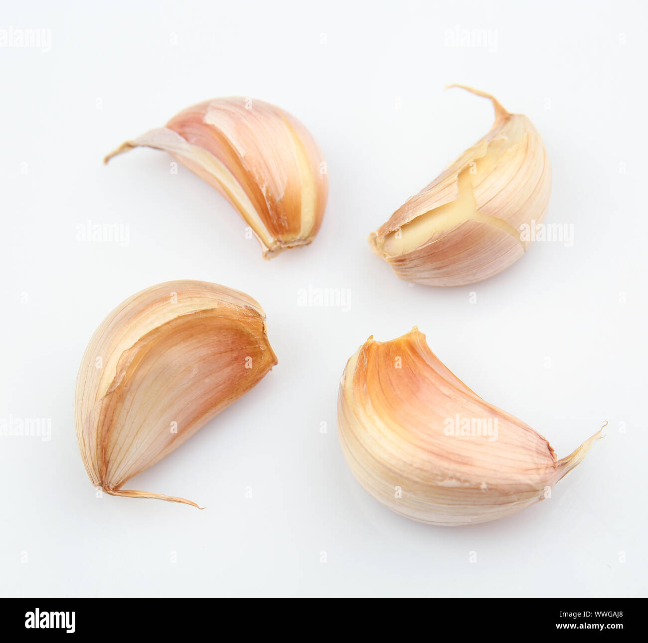 Fresh garlic cloves on white background Stock Photo - Alamy