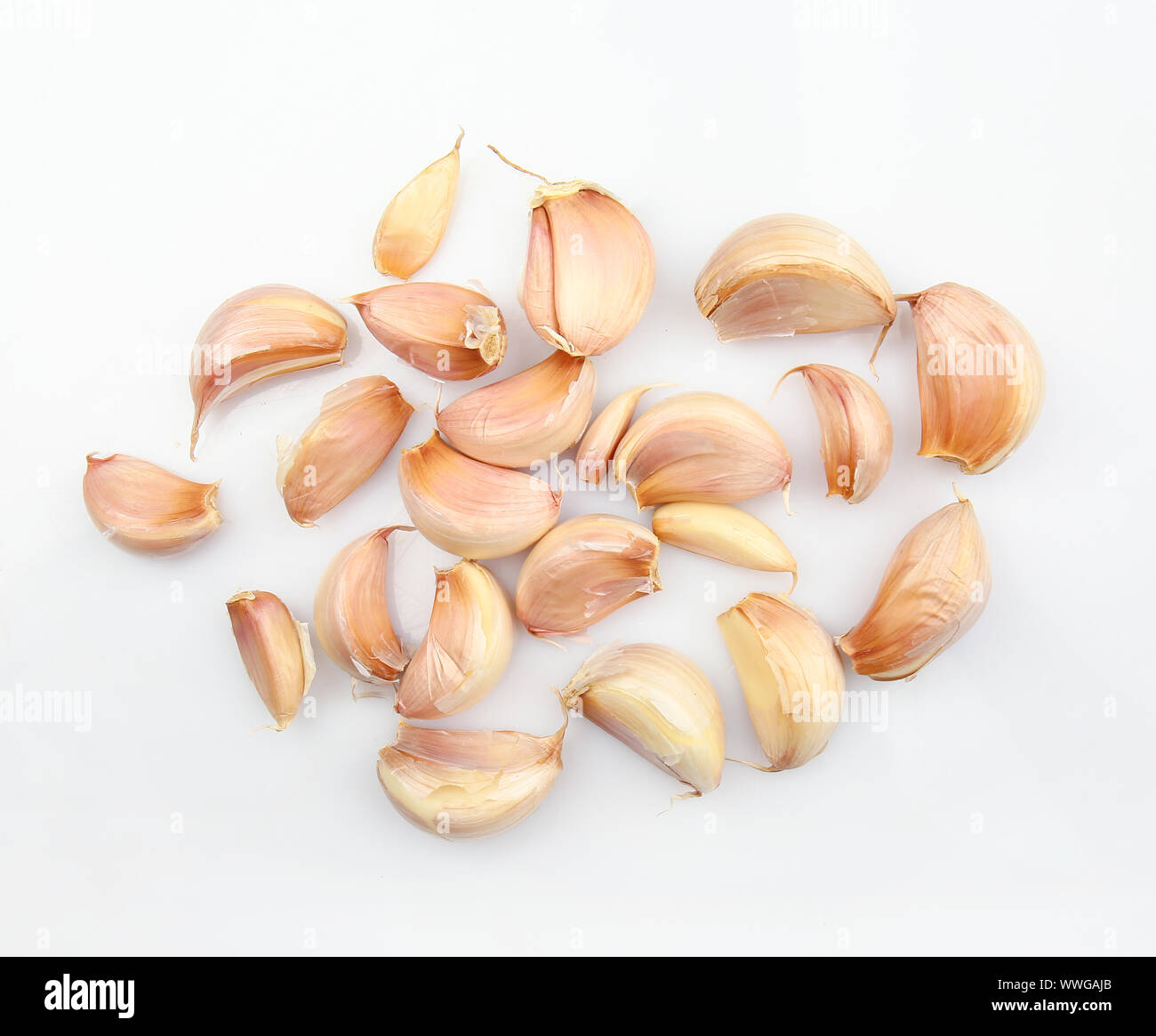 Fresh garlic cloves on white background Stock Photo - Alamy