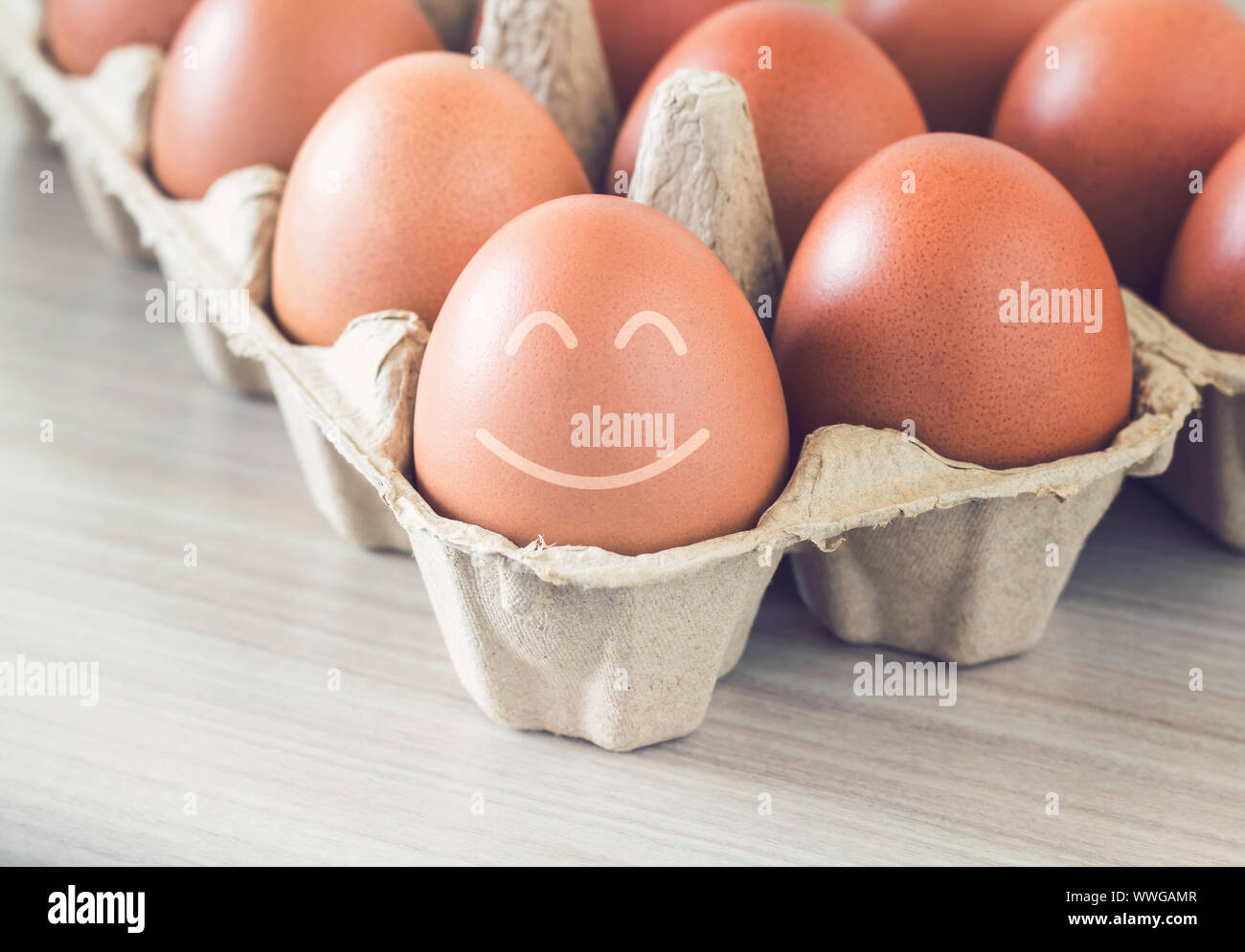 Happiness concept, egg smile on vintage background Stock Photo - Alamy