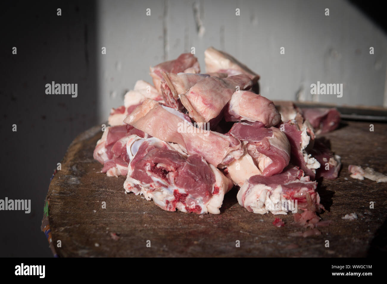Meat or butcher shop at vintage or old market. Fresh meat on wooden stump. Stock Photo