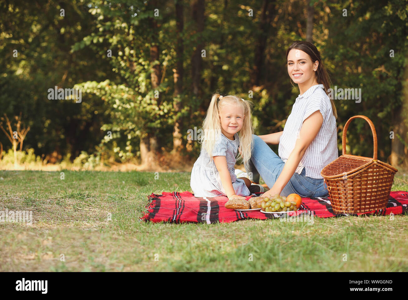 Happy mother and daughter at picnic outdoors Stock Photo - Alamy