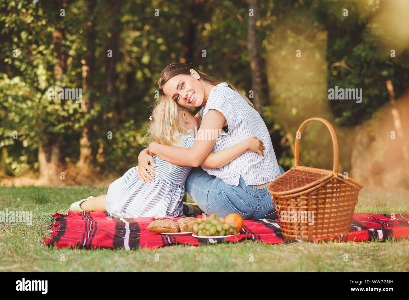 Happy mother and daughter at picnic outdoors Stock Photo - Alamy