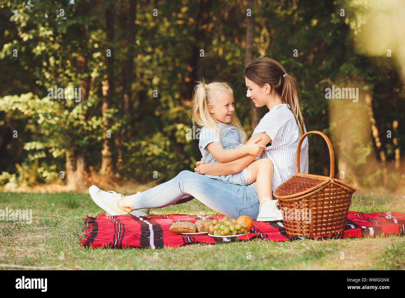 Happy mother and daughter at picnic outdoors Stock Photo - Alamy