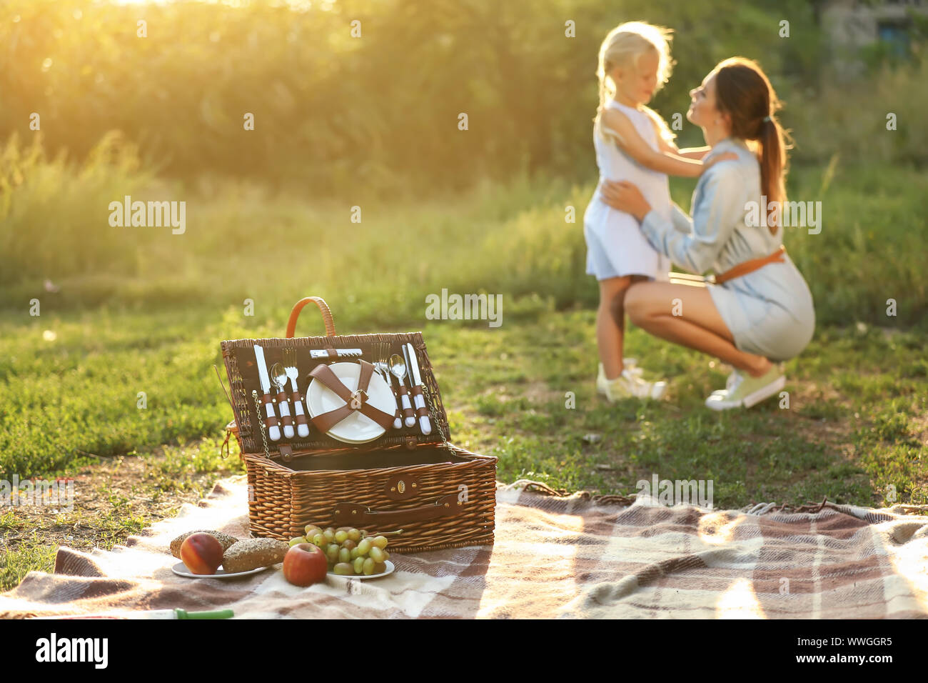 Happy mother and daughter at picnic outdoors Stock Photo - Alamy