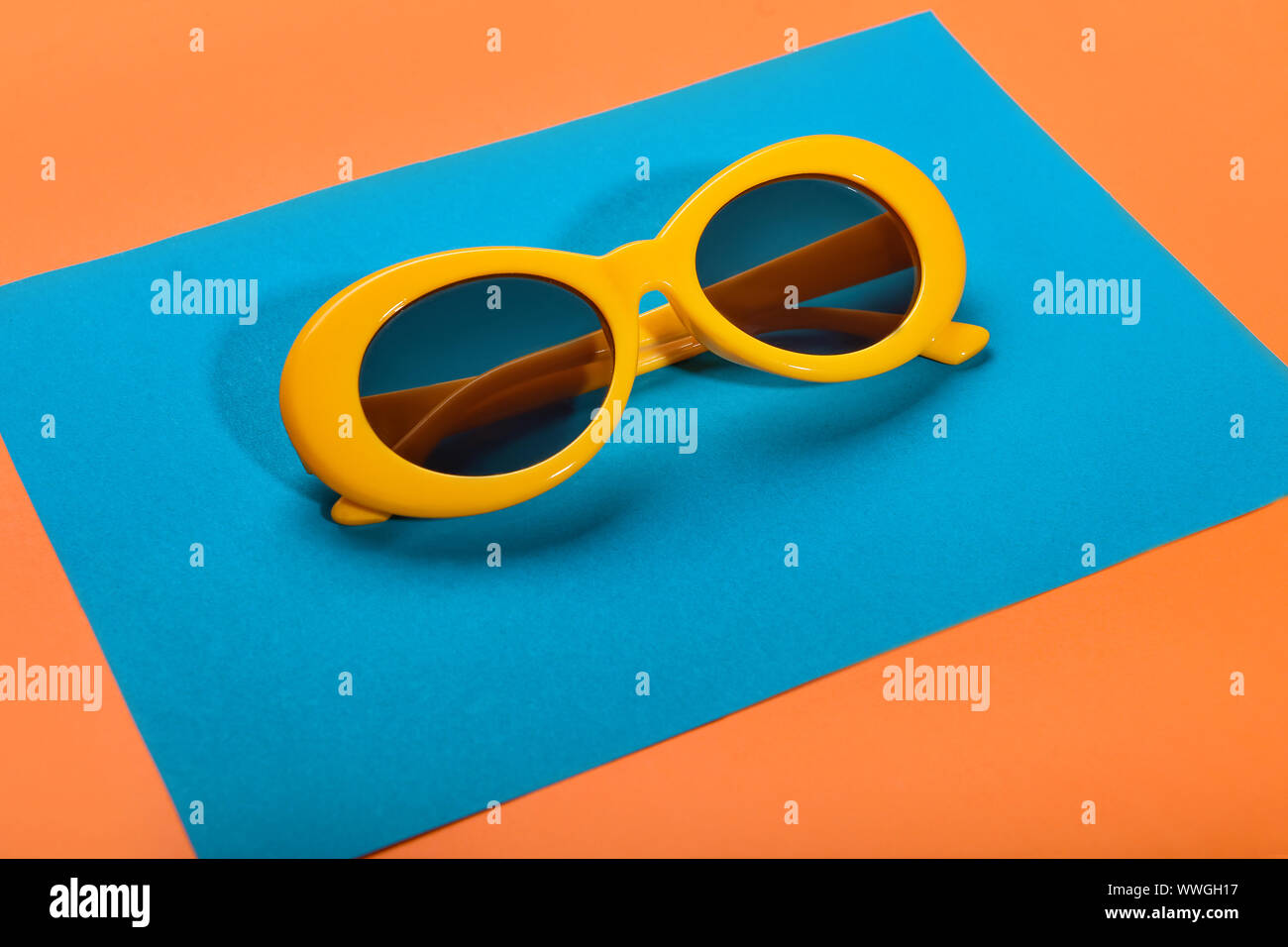 Stylish sunglasses and paper sheet on color background Stock Photo - Alamy