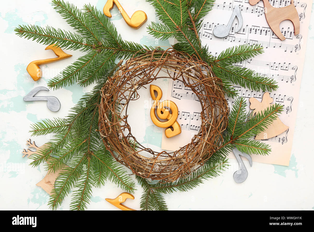 Composition with note sheets and Christmas decor on light background Stock Photo